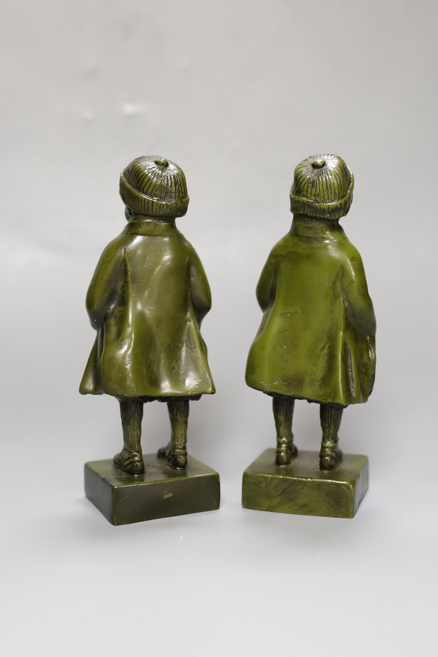 Two green patinated bronze figures of a boy. 18.5cm